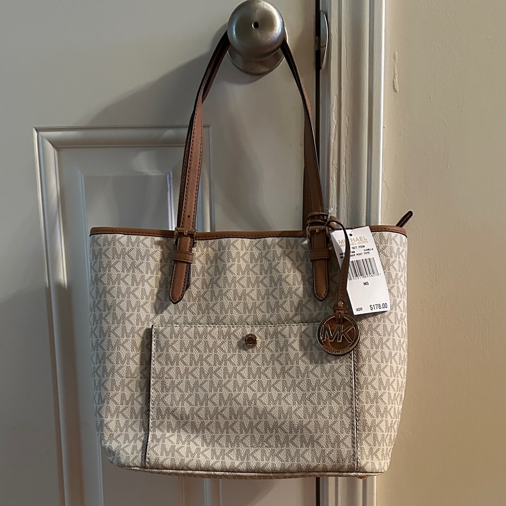 Michael Kors Cream and Tan Signature Tote. Never used. Brand new.